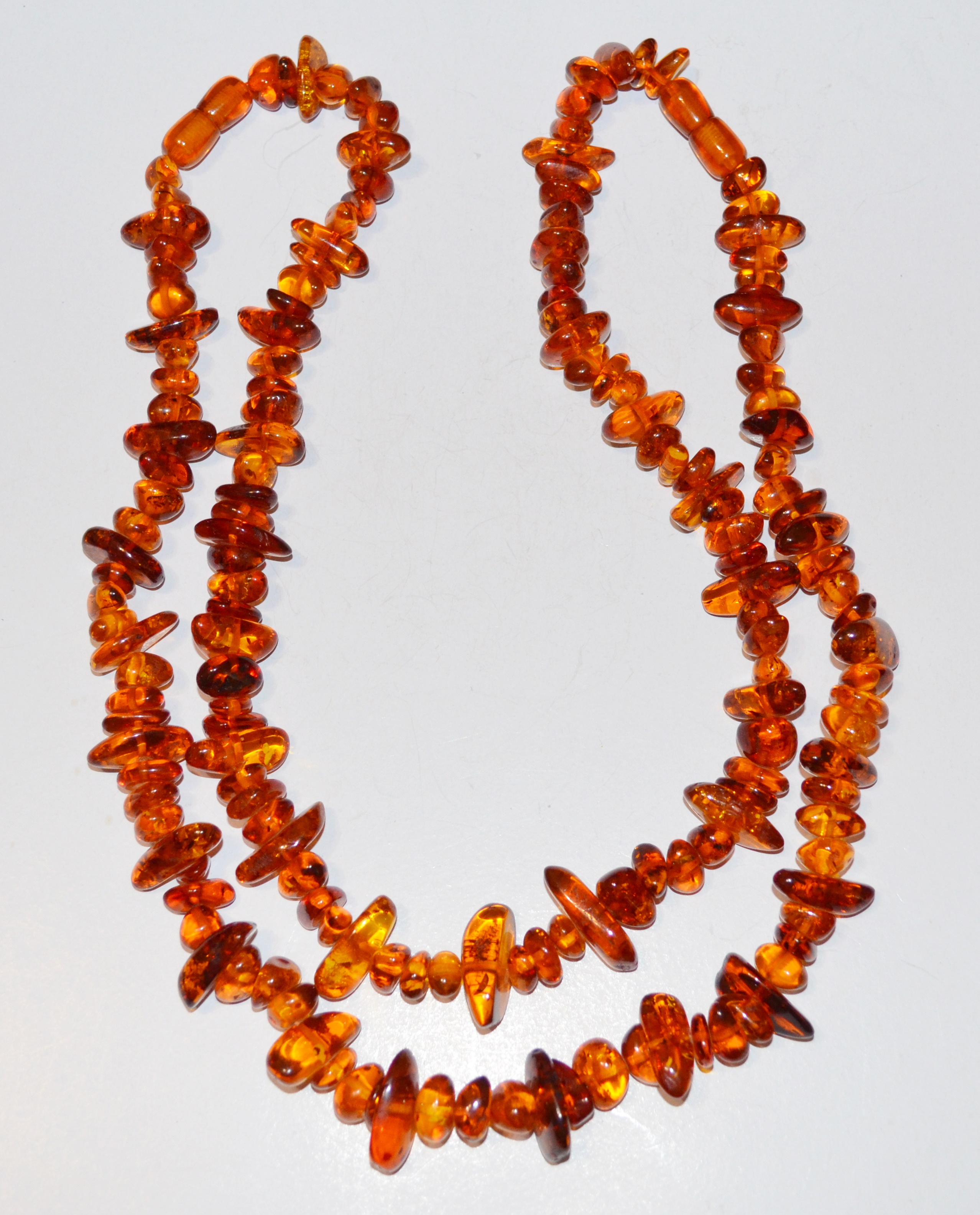 PAIR - POLISHED AMBER NECKLACES