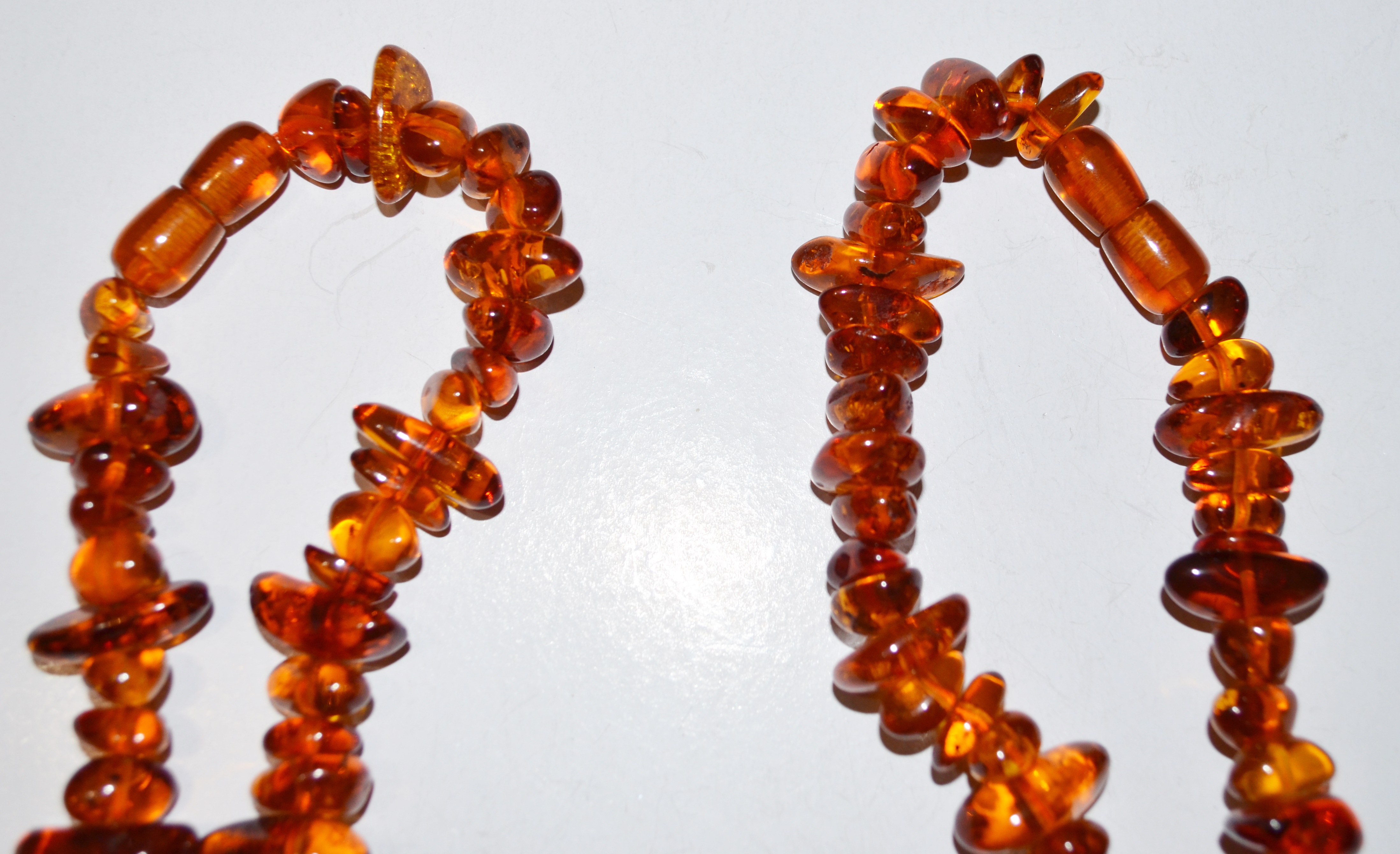 PAIR - POLISHED AMBER NECKLACES